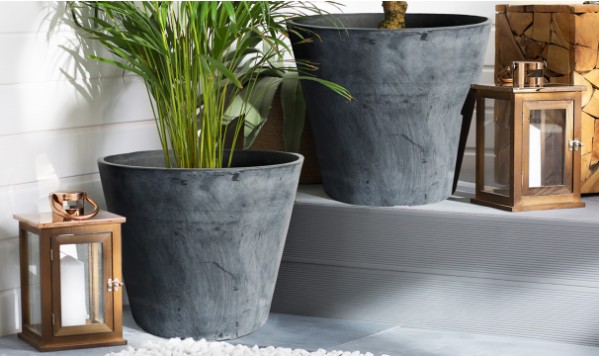 What new and creative surface designs or textures can be expected on plastic planters in 2023?